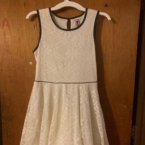 White lace dress, thick straps and black trim